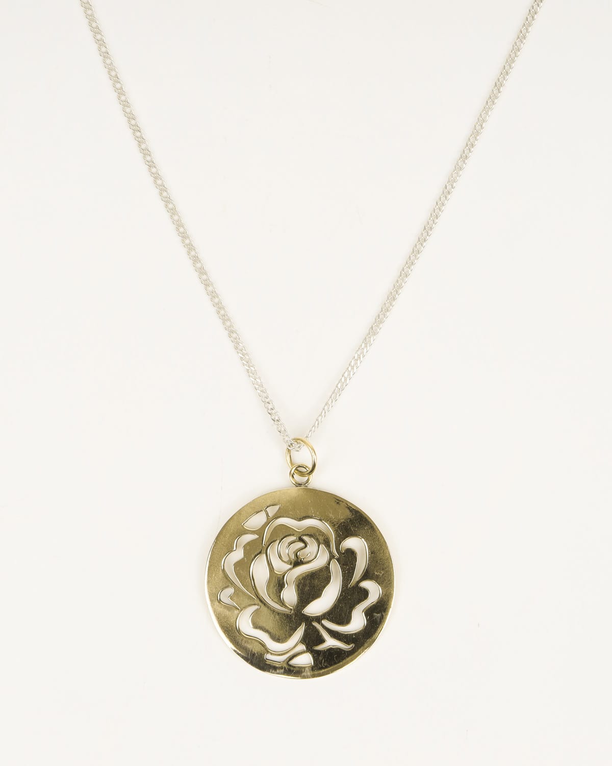 handcrafted circular flower pendant