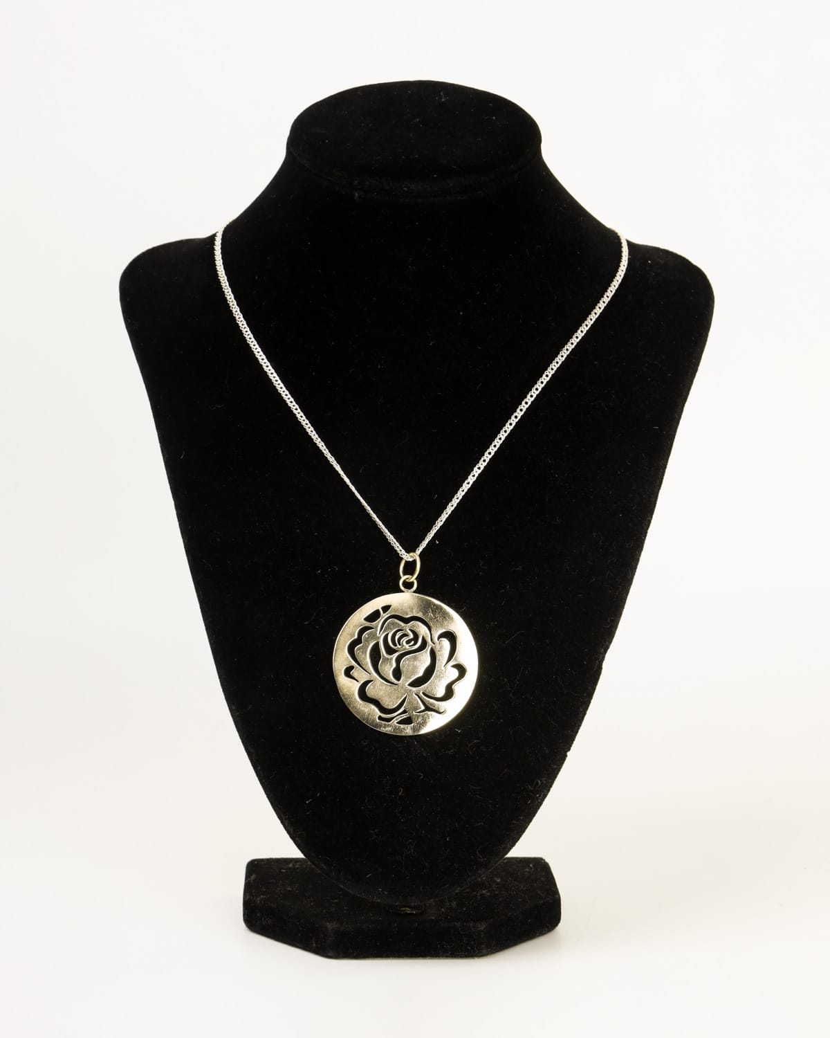 handcrafted circular flower pendant
