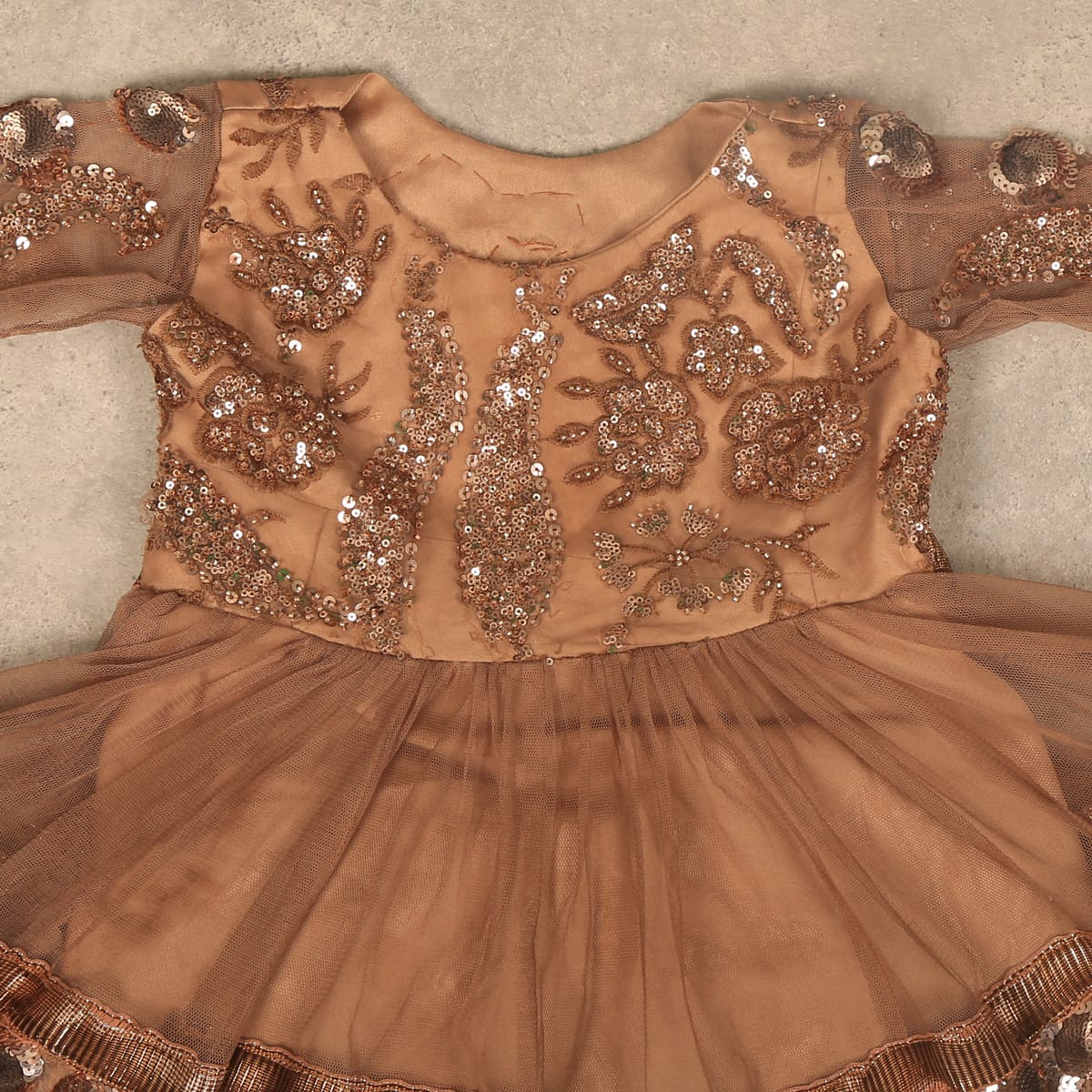 infant hand sewing dress