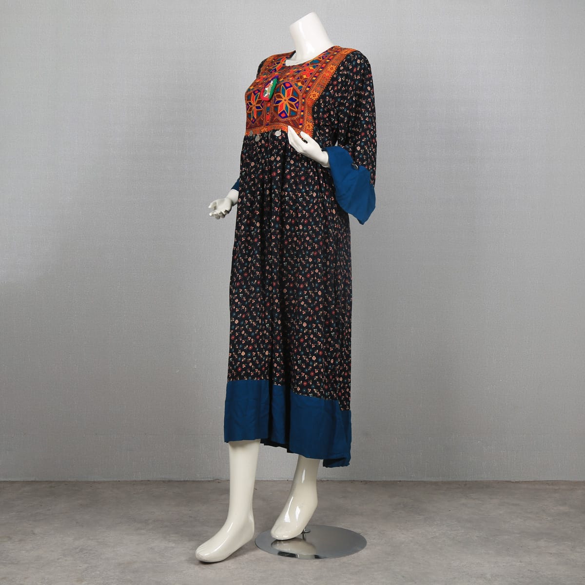 Traditional Afghan Dress with Colorful Embroidery and Floral Print
