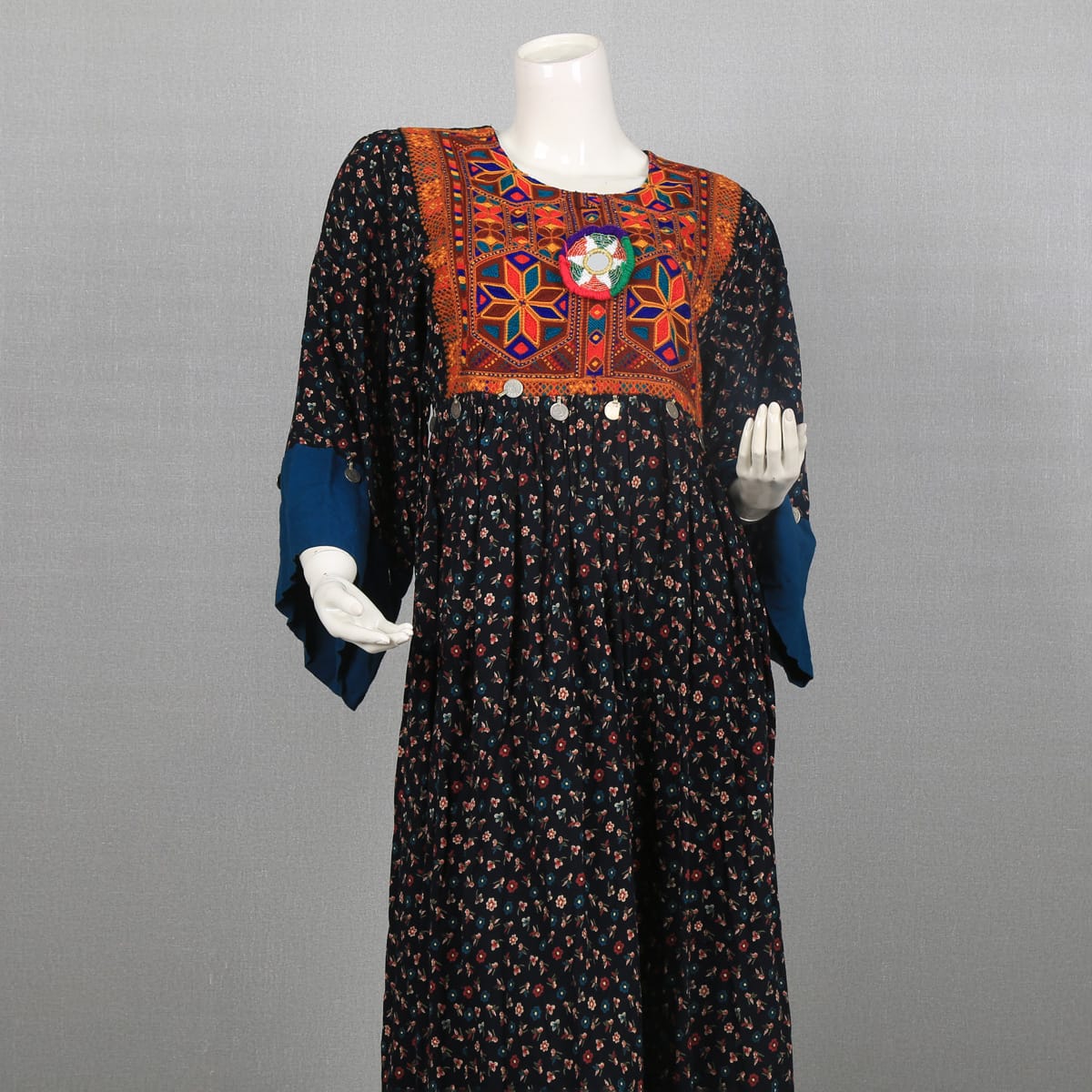 Traditional Afghan Dress with Colorful Embroidery and Floral Print