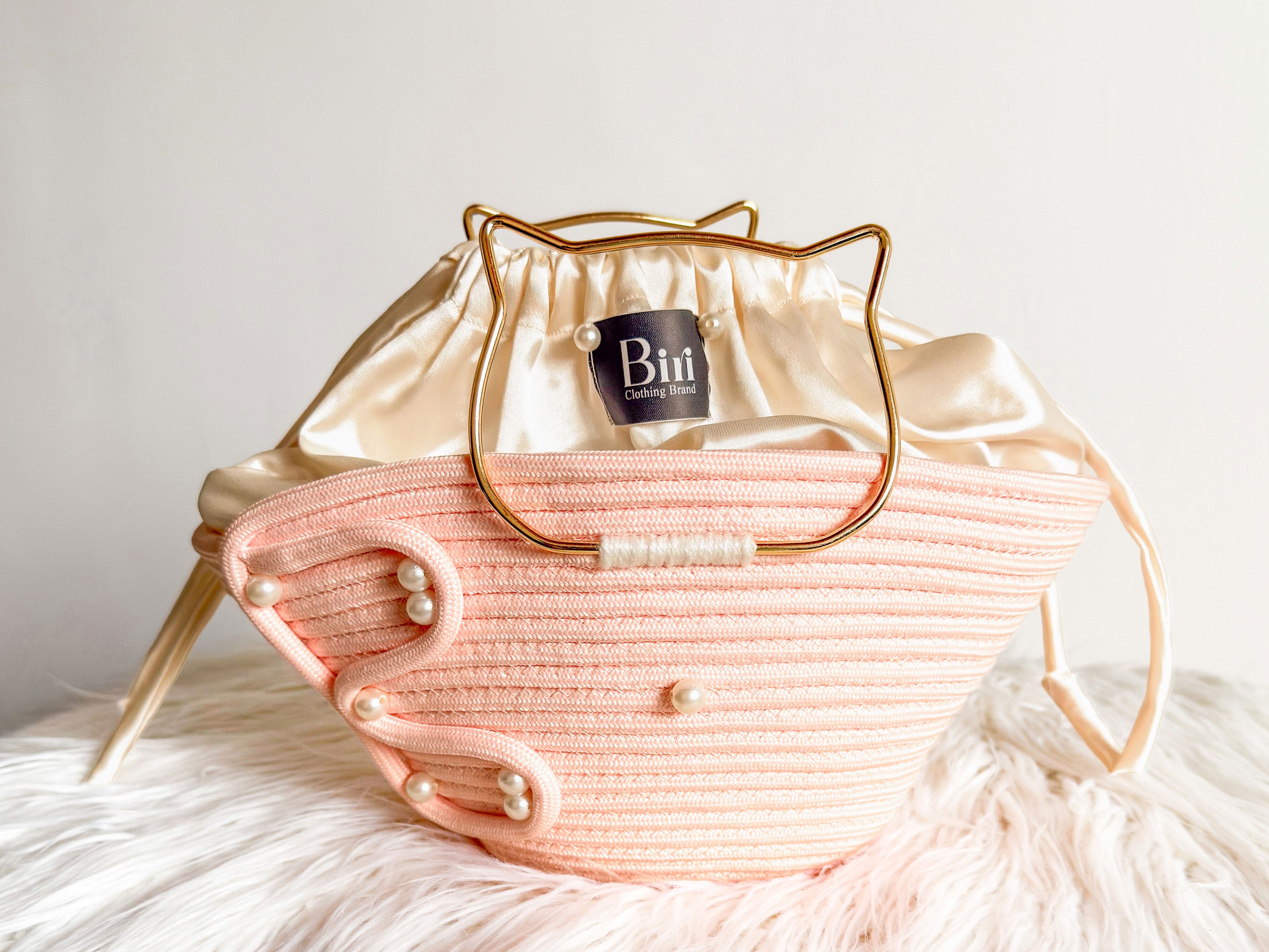 The Biri Artisan Pearl-Drop Handbag: Handwoven Blush Pink Edition